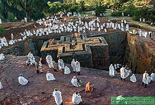 Photo of the amazing rocky churches of Ethiopia and their colorful priests